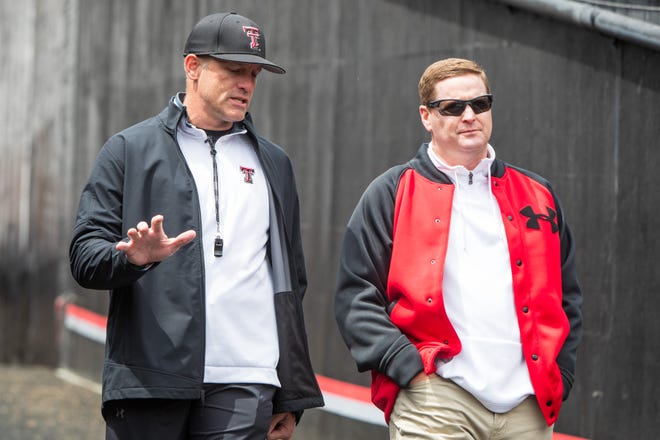 Texas Tech head coach Matt Wells talks with athletic director Kirby Hocutt before their annual spring game on Saturday, April 17, 2021, at Jones AT&T Stadium in Lubbock, Texas.