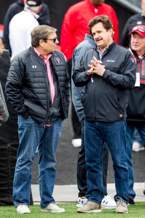 Texas Tech men’s basketball head coach Mark Adams talks with Texas Tech President Lawrence Schovanec during the annual football spring game on Saturday, April 17, 2021, at Jones AT&T Stadium in Lubbock, Texas.